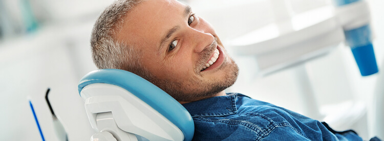 smiling man at the dentist